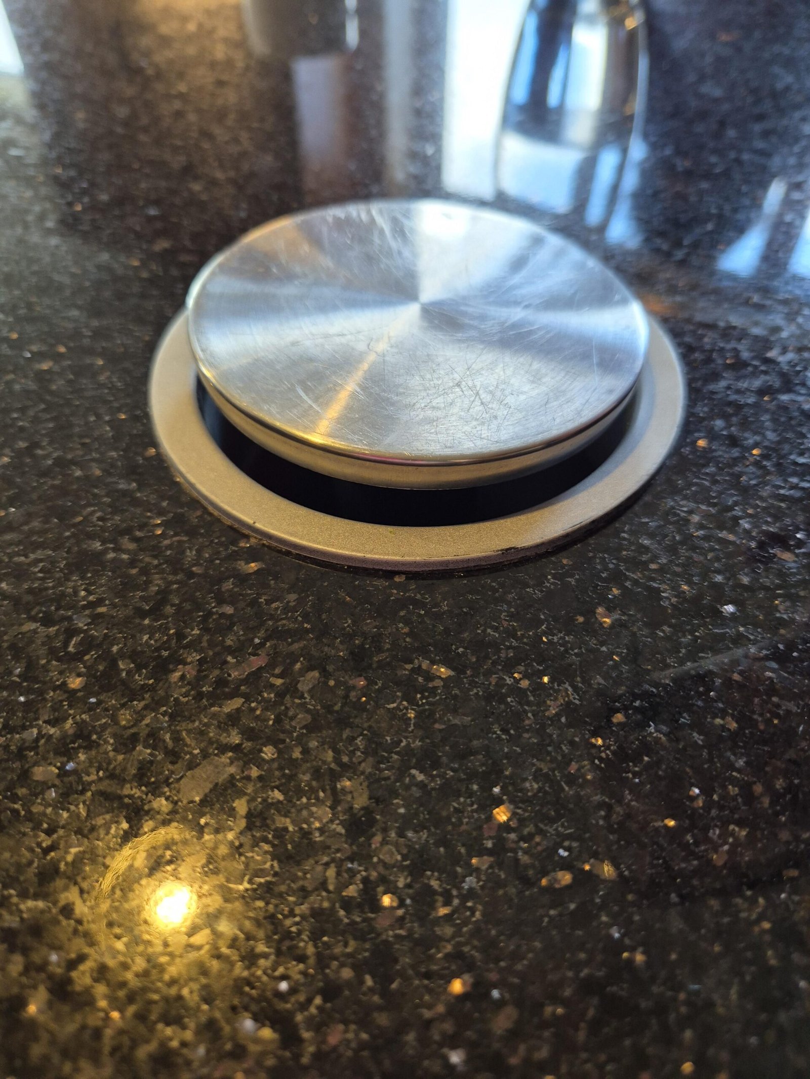We Found This Metal Circle Built Into the Kitchen Counter of Our Rental. When We Pressed It, We Couldn’t Believe What It Did.